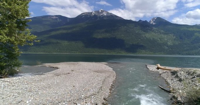 Majestic mountain river in Devis Creek, Vancouver, Canada. Drone flying. Aerial view with mountain background.