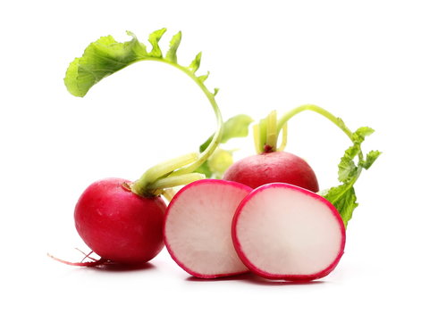 Fresh red radishes slice with leaves isolated on white background