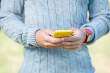 Close up of male hands that holding telephone