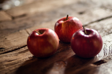 red apples on wooden table