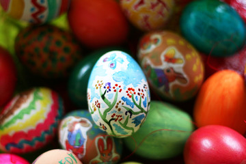 Fototapeta na wymiar Handmade colored vibrant easter eggs.