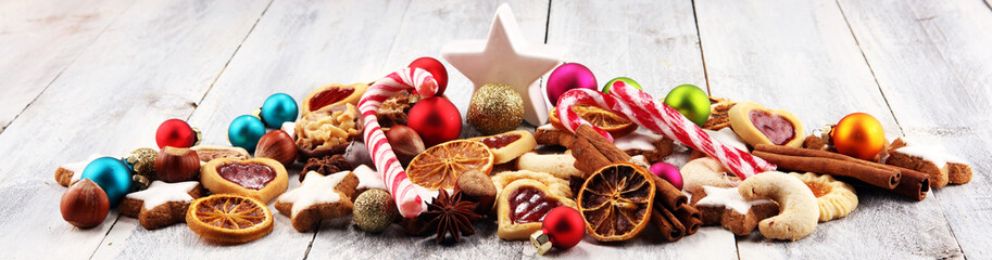Decoration with christmas cookies. Typical cinnamon stars with fruits and nuts
