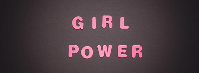 GIRL POWER writing on black paper background