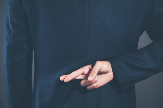 man finger cross
