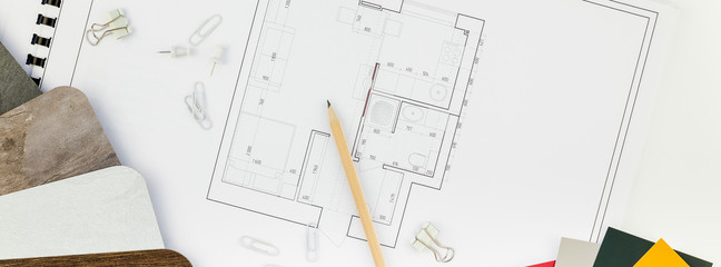 Interior designer table workplace with house plan