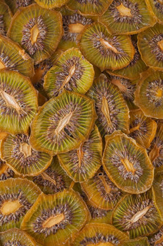 Dried kiwi slices (chips) background.