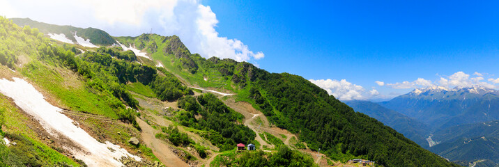 panorama of the mountains and the valley of the river. Mountains near the ski resort of Rosa Khutor in Krasnaya Polyana. Sochi, Russia.