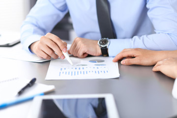 Group of business people working as a team at meeting. close-up. Colleagues or partners  discussing financial results. Successful negotiation concept