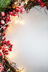 Christmas decoration on the left side of white background with lights