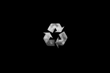 Steel recycle symbol on black background