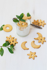 sweet homemade yogurt with cookies in a glass cup