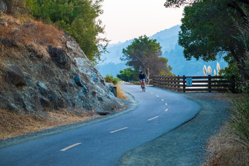 Cyclist on a winding road