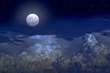 Naklejka na ściany i meble Full moon and stars in cumulus clouds