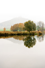 Beautiful autumn landscape and famou castle called Wachsenburg in the background, Thuringia, Germany