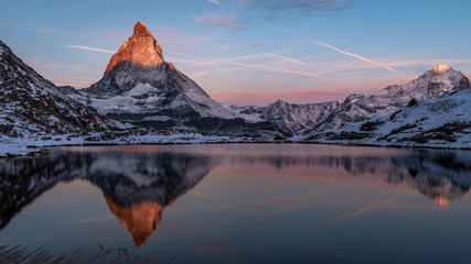 Fototapeta na wymiar A beautiful sunrise on The Matterhorn after the first snowfall of the season.