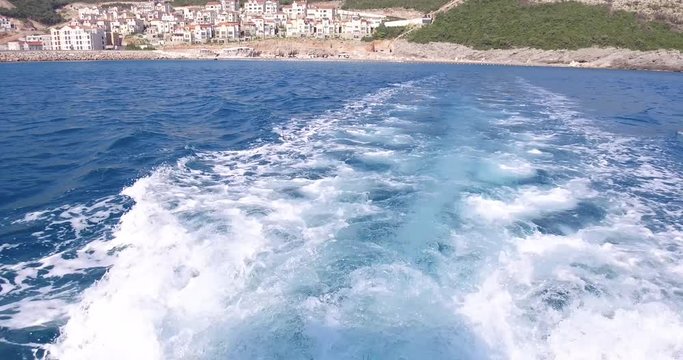 Luxury yacht sailing in the sea on mountains background view from board