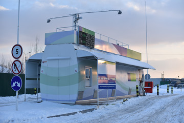 gas station with self-service in winter evening
