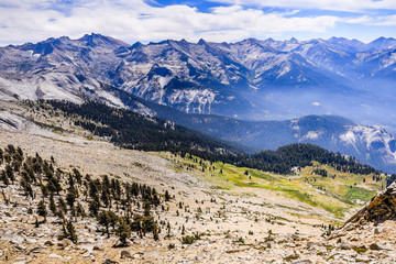 Alpine landscape and view towards eastern Sierra Nevada mountains as seen from Alta Peak on a sunny summer day; Sequoia National Park, California