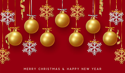 Fototapeta na wymiar Golden Christmas balls background. Festive xmas decoration gold bauble and bright snowflake, hanging on the ribbon.