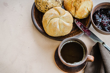 Simple breakfast: coffee americano, fresh buns and jam.