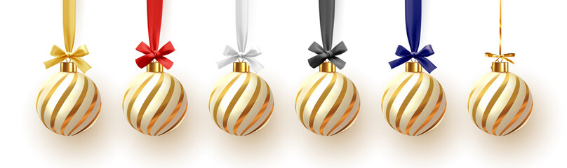 Christmas ball hanging on ribbon with golden bow