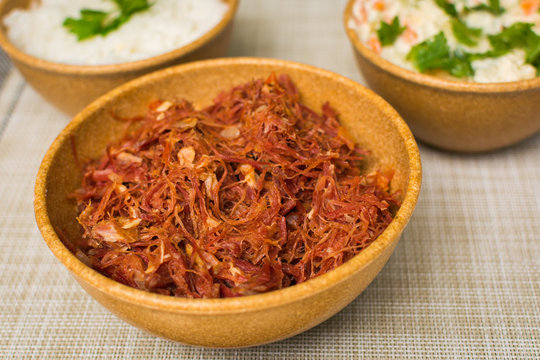 dried beef with rice and mayonnaise on the table
