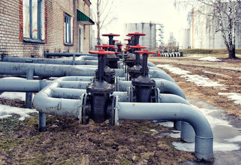 Fototapeta na wymiar Old oil and gas pipe line valves