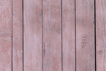 Obraz premium Mountbatten pink old wooden fence. wood palisade background. planks texture, weathered surface