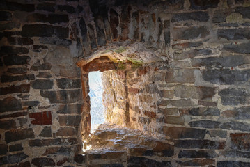 A window into an ancient brick wall