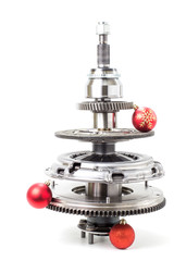 Abstract christmas tree of car parts on a white background. Decorated with Christmas toys, garland