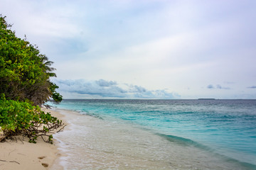 Stunning tropical beach with white sand in the Maldives. a great place to dive into meditation and Nirvana