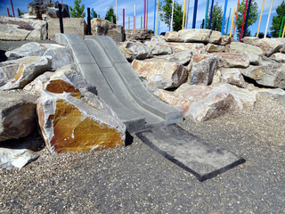 A concrete children's slide in a park located in Boise, Idaho, USA