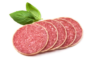 Sliced Italian Homemade Salami. Salami in Cheese with basil leaves, isolated on a white background. Close-up.