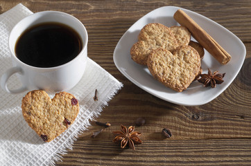 Heart shaped cookies, coffee and winter spices