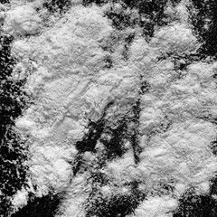 Isolated natural white flour powder texture effect on clean black background. Organic baking element close-up.