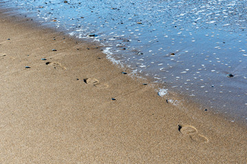 footprints on the beach