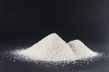 sugar on black background