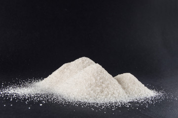 sugar on black background