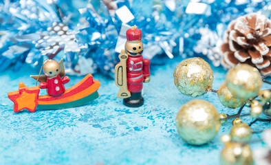 A closeup of a Christmas decoration with a messenger on a blue background. Christmas decorations on the Christmas tree. closeup of New Year's toys. Santa Claus.