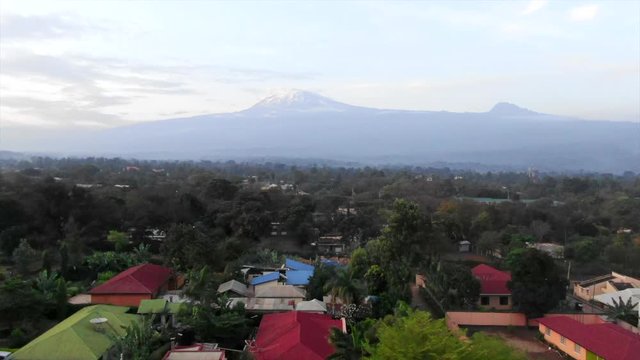 Aerial Shot Flying Towards Mount Kilimanjaro Over a Rural Village in Tazania