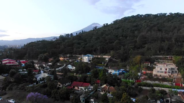 Aerial Reveal Shot of a Mountain in a Rural Village in Tanzania