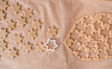 cutouts of cookie dough on the wooden board