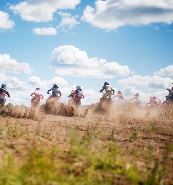 Low angle view of motocross on field against sky