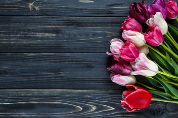 colorful tulips  on the gray wooden table. Valentines, spring background. floral mock up.  with copyspace