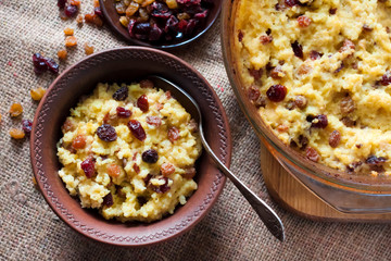 Sweet millet porridge with raisins and dried cranberries