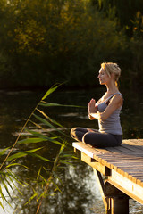 Young happy woman  practicing yoga