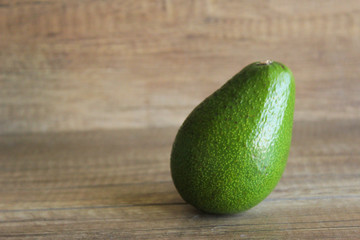 Avocado on wooden background