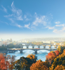 Fototapeta na wymiar Central Prague and six bridges on Vltava river in Prague, Czech Republic, on a misty morning in Fall