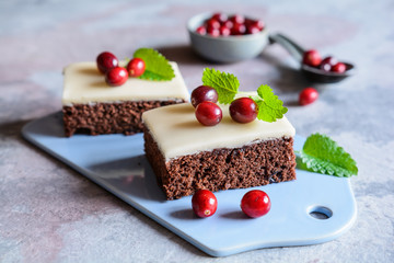 Cocoa cake with cranberries and marzipan glaze