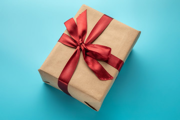 Flat lay of gift on blue background